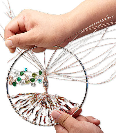 Beads being added to wire in loop